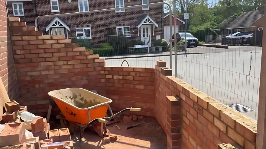 Brick wall being built